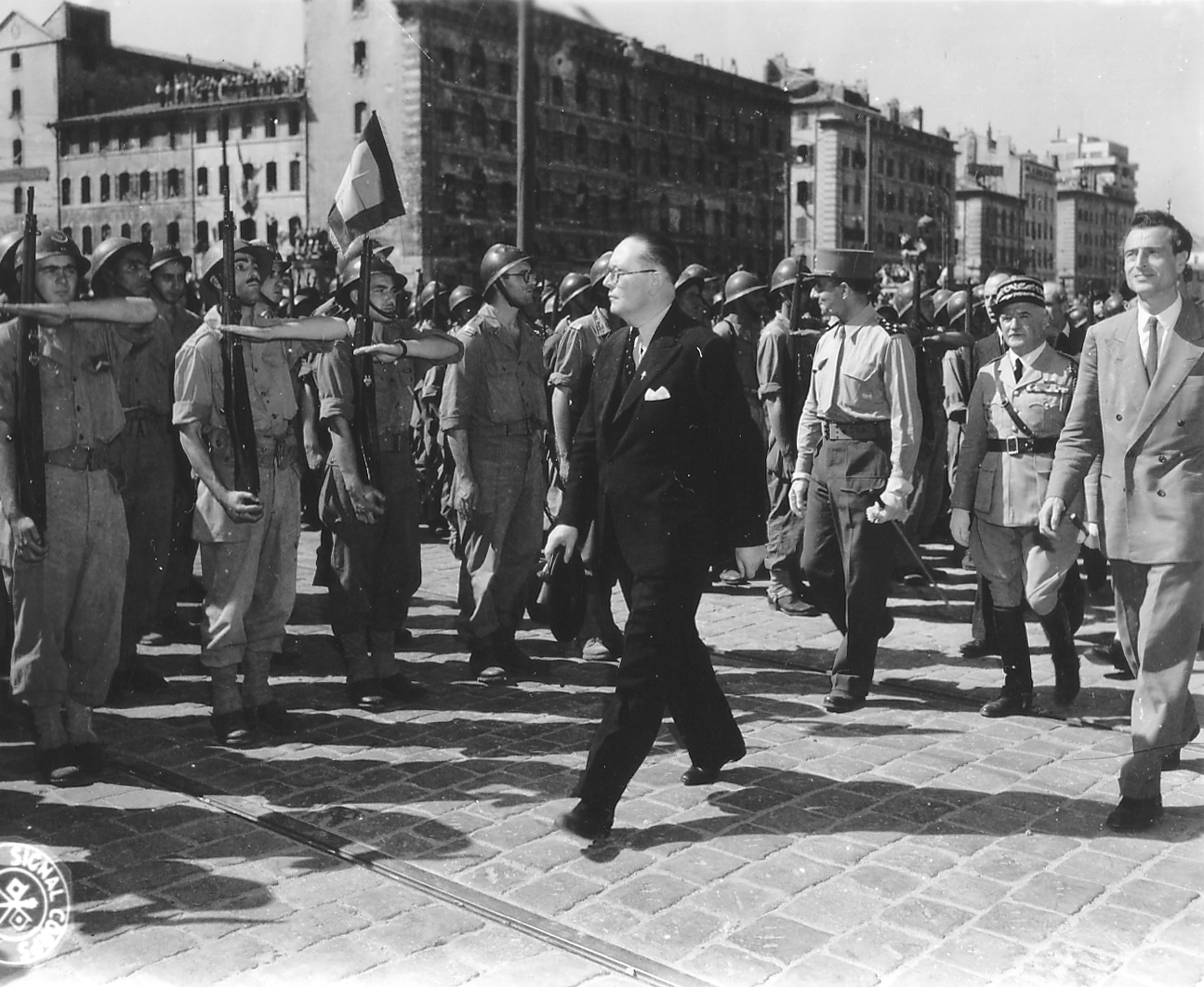 André Diethelm, Jean de Lattre de Tassigny, Emmanuel d'Astier de La Vigerie, and General Monsabert reviewing troops, Marseille, France, 29-31 Aug 1944