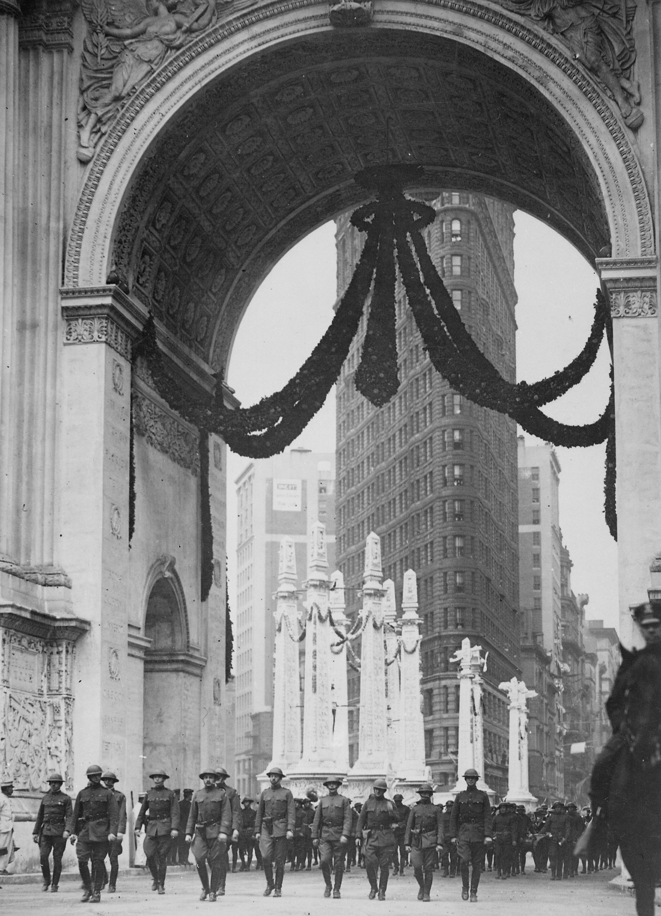 Colonel William Donovan and the staff of 165th Infantry Regiment passing under the Victory Arch, New York, New York, United States, 1919