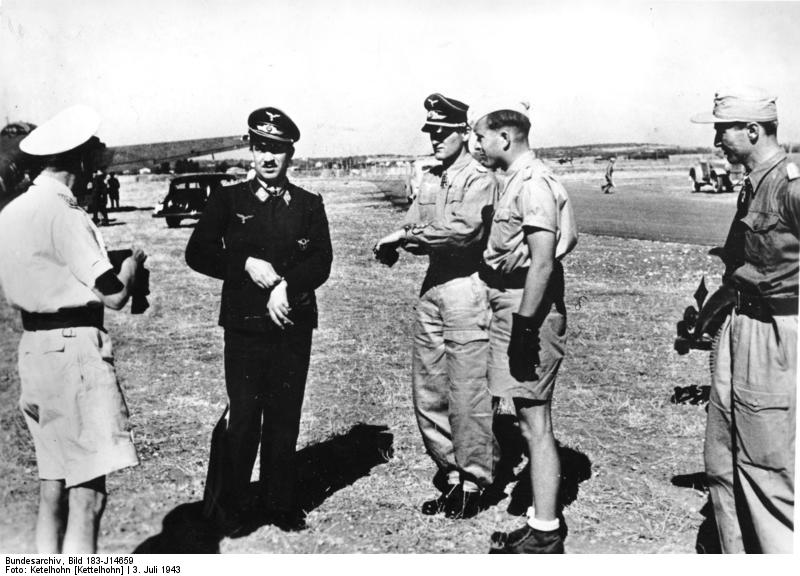 German Luftwaffe Lieutenant General Theodor Osterkamp, Major General Adolf Galland, Colonel Günther Lützow, and Lieutenant Colonel Günther von Maltzahn on an airfield in Italy, 3 Jul 1943