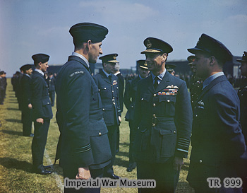 King George VI speaking with Flight Lieutenant Les Munro, observed by Wing Commander Guy Gibson and Air Vice Marshal Ralph Cochrane, Scampton, England, United Kingdom, 27 May 1943
