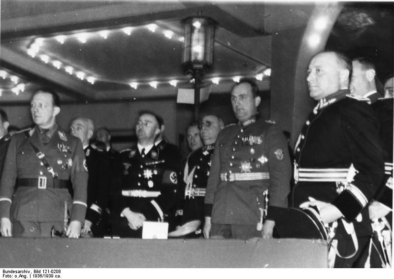 Heinrich Himmler and Berlin police chiefs Wolf Heinrich Graf von Helldorff and Kurt Daluege at a sporting event held in honor of Italian police leaders' visit to Berlin, Germany, 1936; photo 5 of 8