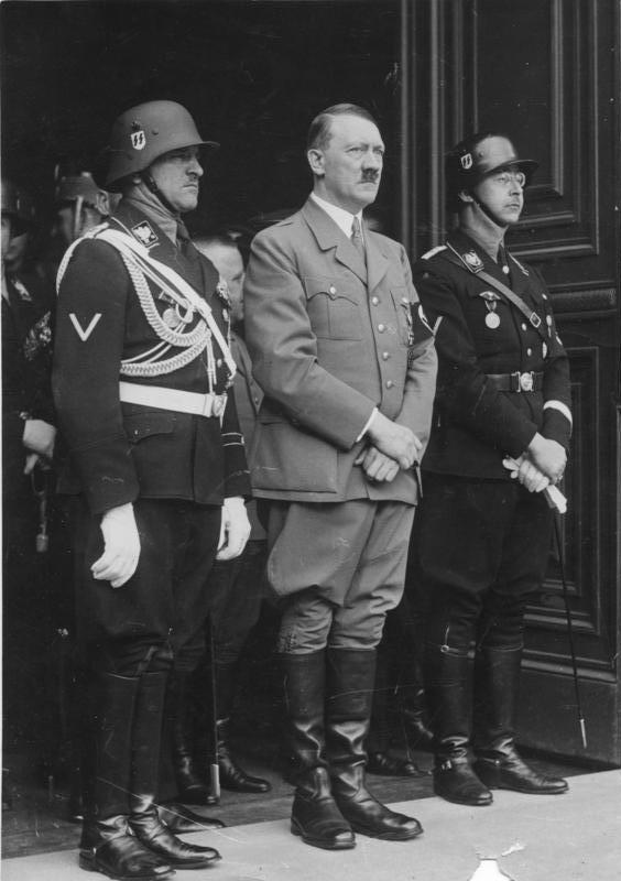 Josef Dietrich, Adolf Hitler, and Heinrich Himmler at the entrance of the Chancellery in Berlin, Germany, 20 Apr 1937 during a celebration for Hitler's birthday