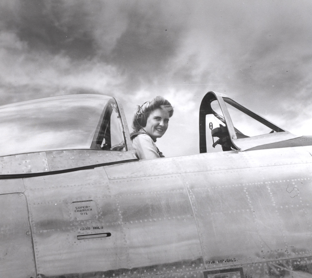 Celia Hunter in the cockpit of a P-47 fighter, date unknown