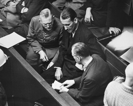 Wilhelm Keitel, Ernst Kaltenbrunner, and Alfred Rosenberg in discussion at the Nuremberg Trial, Germany, 1945-1946