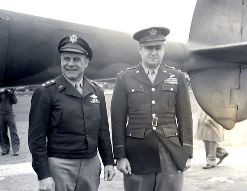 US Army Lieutenant General James Doolittle and Major General Curtis LeMay at 8th Air Force headquarters, High Wycombe, England, United Kingdom, 1945; note a tail boom of a P-38 Lightning behind them