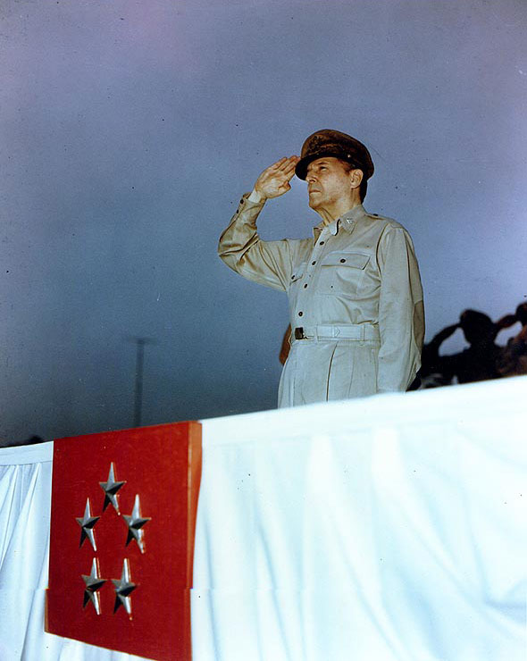 MacArthur saluted as he reviewed the American Independence Day parade at the Emperor's Palace plaza, Tokyo, Japan, 4 Jul 1948