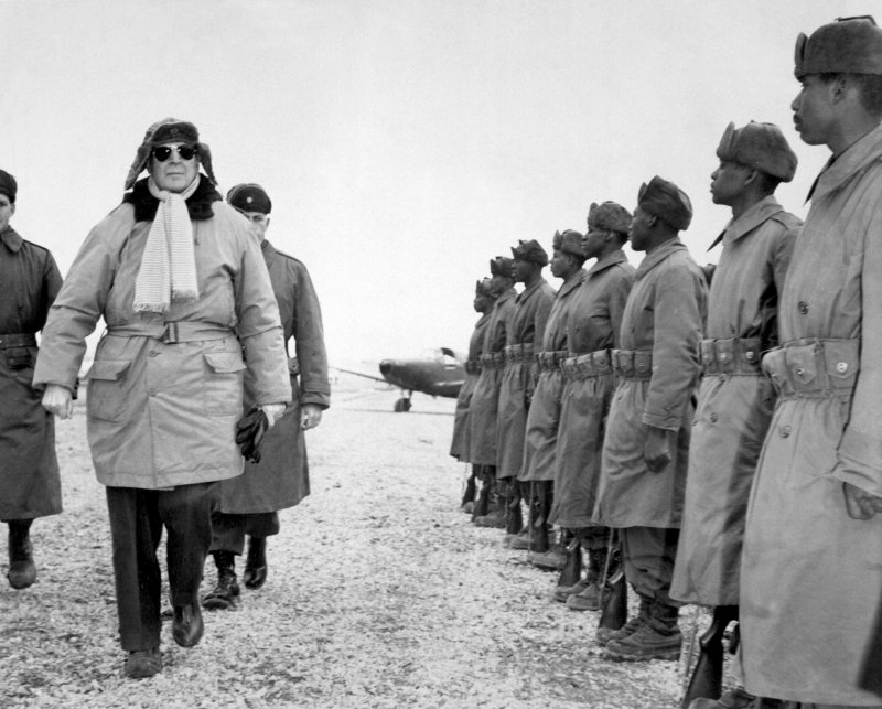 General of the Army Douglas MacArthur inspecting troops of the 24th Infantry Division at Gimpo airfield near Seoul, Korea, 21 Feb 1951