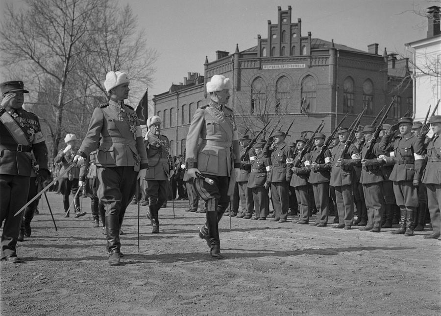 Marshal Mannerheim inspecting troops at the 20th anniversary of independent Finland, Viipuri, Finland, 1938; note Lieutnant General Harald Öhqvist with sword beside him