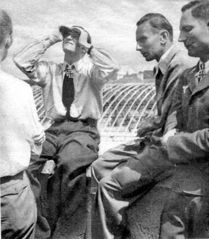 Hans-Joachim Marseille observing the flight of a new Bf 109 fighter, Augsburg, Germany, Jul 1942