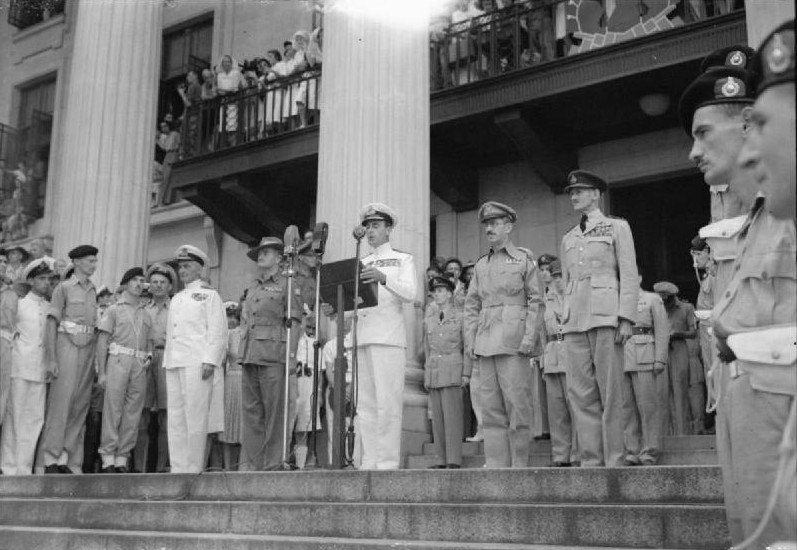 Supreme Allied Commander South East Asia Admiral Lord Louis Mountbatten delivering an address at the Municipal Building, Singapore, 12 Sep 1945, photo 2 of 2; note William Slim, Raymond Wheeler, and Keith Park