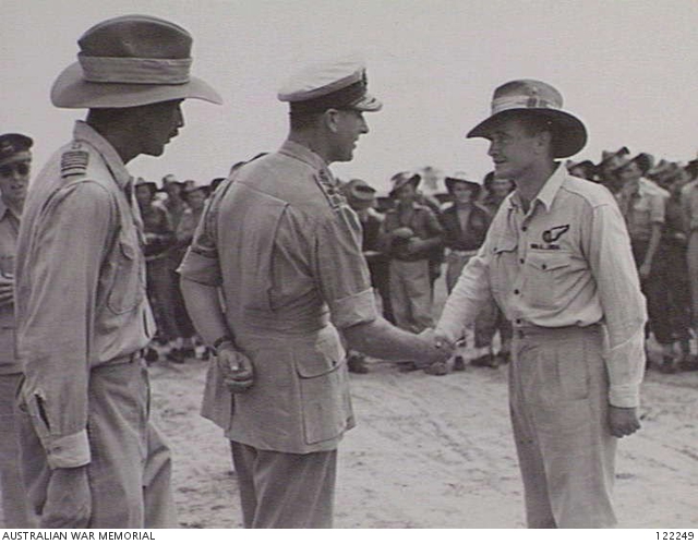 Admiral Louis Mountbatten shaking hands RAAF Warrant Officer T. Hughes of No. 2 Squadron RAAF, Balikpapan, Borneo, 10 Dec 1945