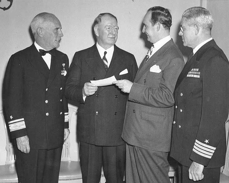 Murray, Knox, and Jenkins received a War Bond check from Atlanta politician John Connor, Mar 1943