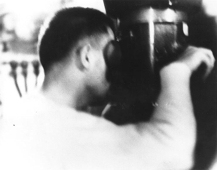 Lieutenant Richard O'Kane at the periscope of USS Wahoo during an attack on a Japanese convoy near New Guinea, 26 Jan 1943