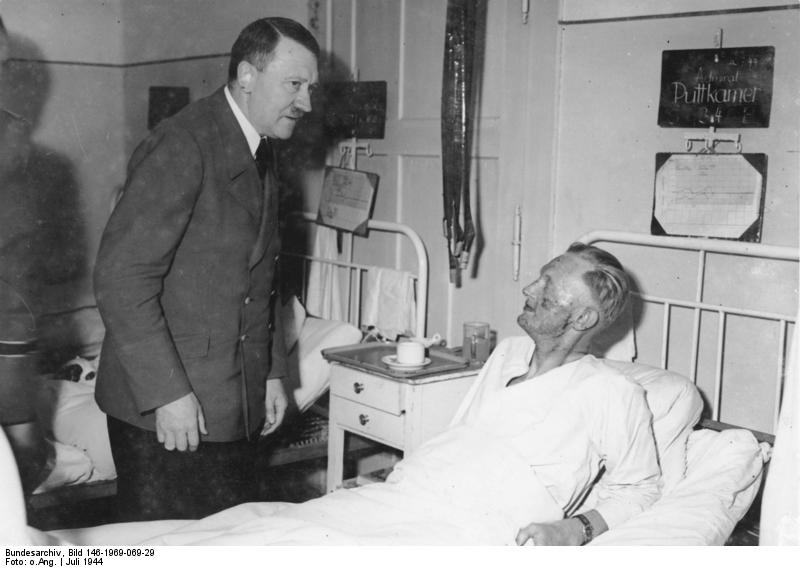 Adolf Hitler visiting the injured Karl-Jesco von Puttkamer in a hospital, late Jul 1944