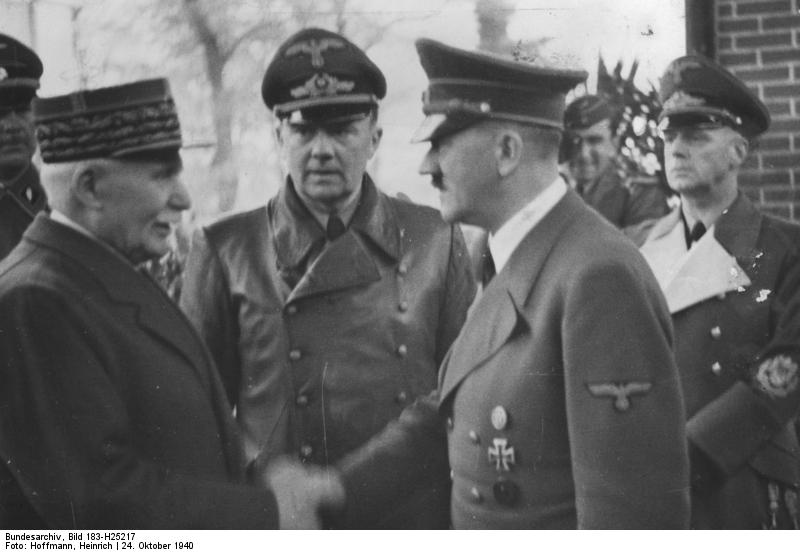 Philippe Pétain and Adolf Hitler, Montoire-sur-le-Loir, France, 24 Oct 1940; note Paul Schmidt and Joachim von Ribbentrop in background