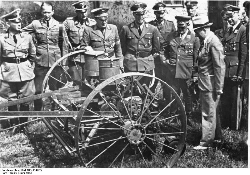 Rosenberg visiting Ukraine, inspecting agricultural equipment, Jun 1943; other men present were Gauleiter Koch, Generalkommissar Claus Selzner, and Gauleiter Helmuth