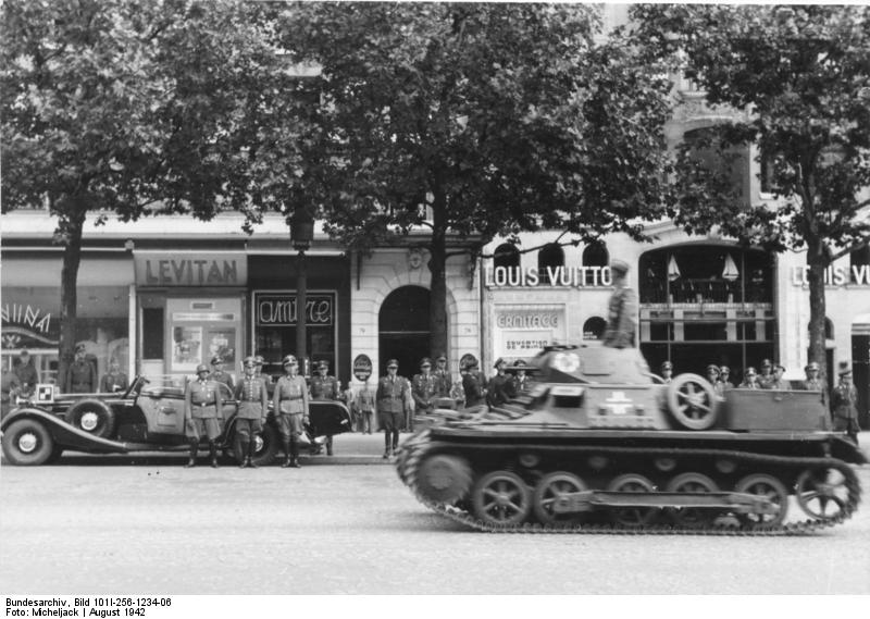 German Panzer I tank on parade through Paris, France, Aug 1942; note Field Marshal Rundstedt in background