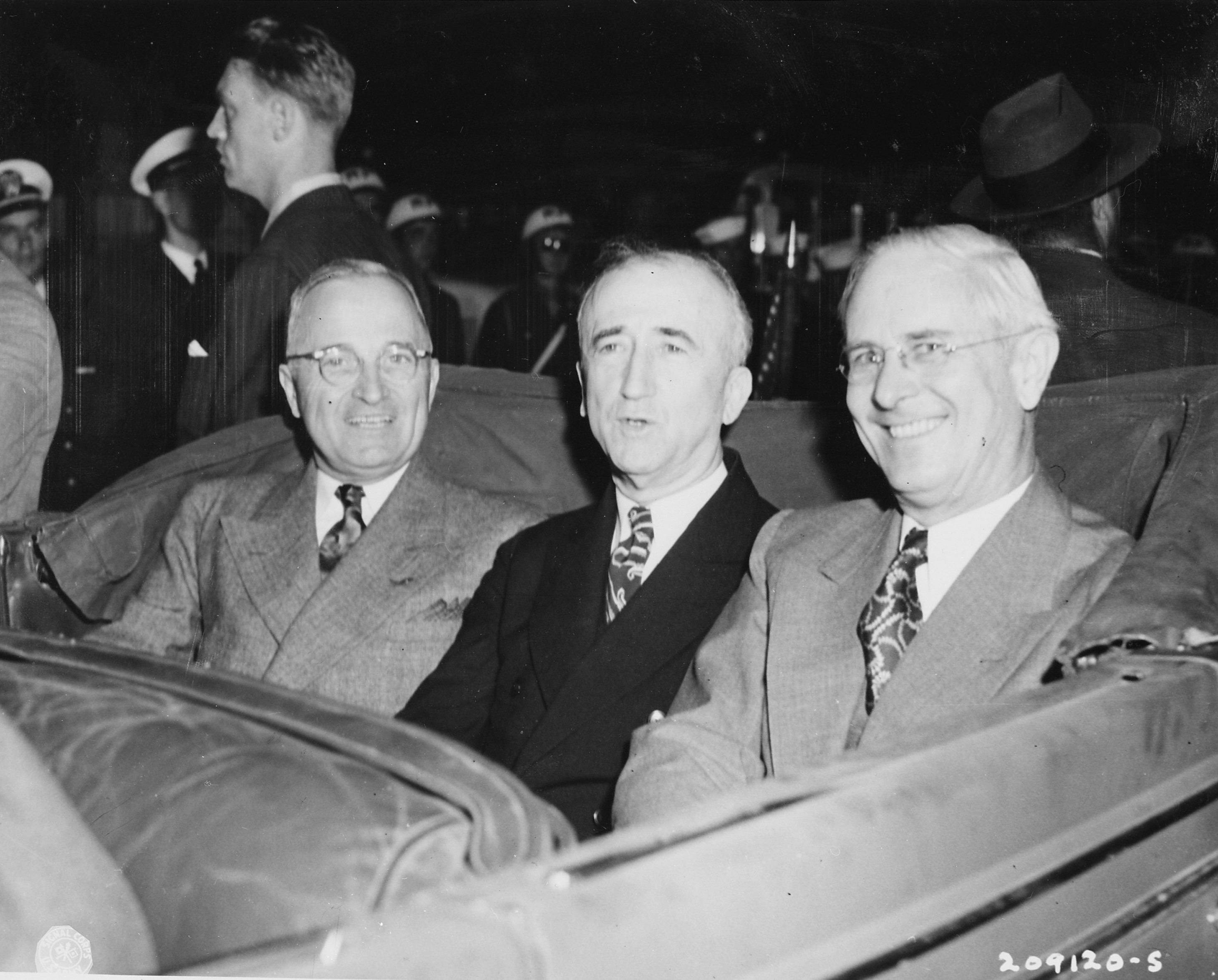 US President Harry Truman, Secretary of State James Byrnes, and Ambassador to Belgium Charles Sawyer in a car, Antwerp, Belgium, 15 Jul 1945, photo 2 of 2