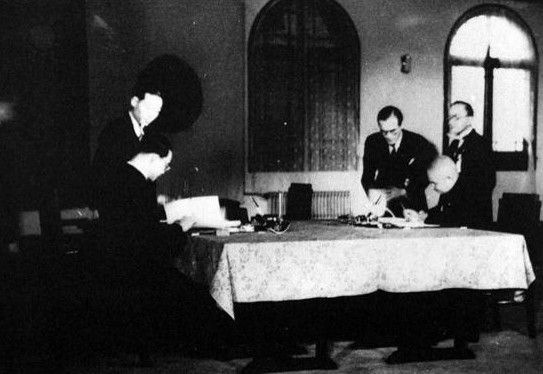 Wang Jingwei signing an agreement with the Japanese over the recognition of the puppet nation of Manchukuo, Nanjing, China, 30 Nov 1940