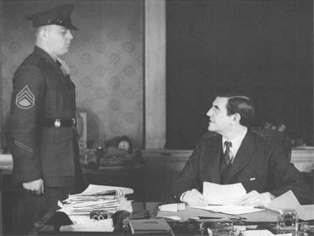 US Ambassador to the UK John Winant speaking to USMC Platoon Sergeant John Allen, Jr. at Court of St. James's, London, England, United Kingdom, 1940s 