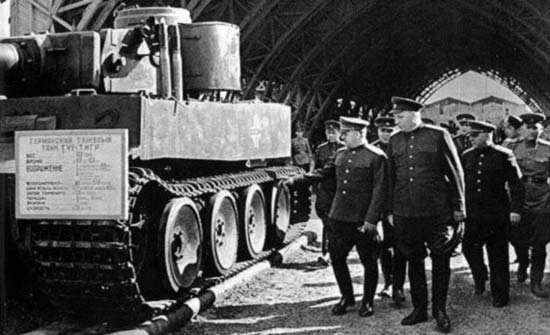 Marshal Georgi Zhukov, Colonel General Nikolay Voronov, and Marshal Kliment Voroshilov inspecting a captured German Tiger I heavy tank, 1943