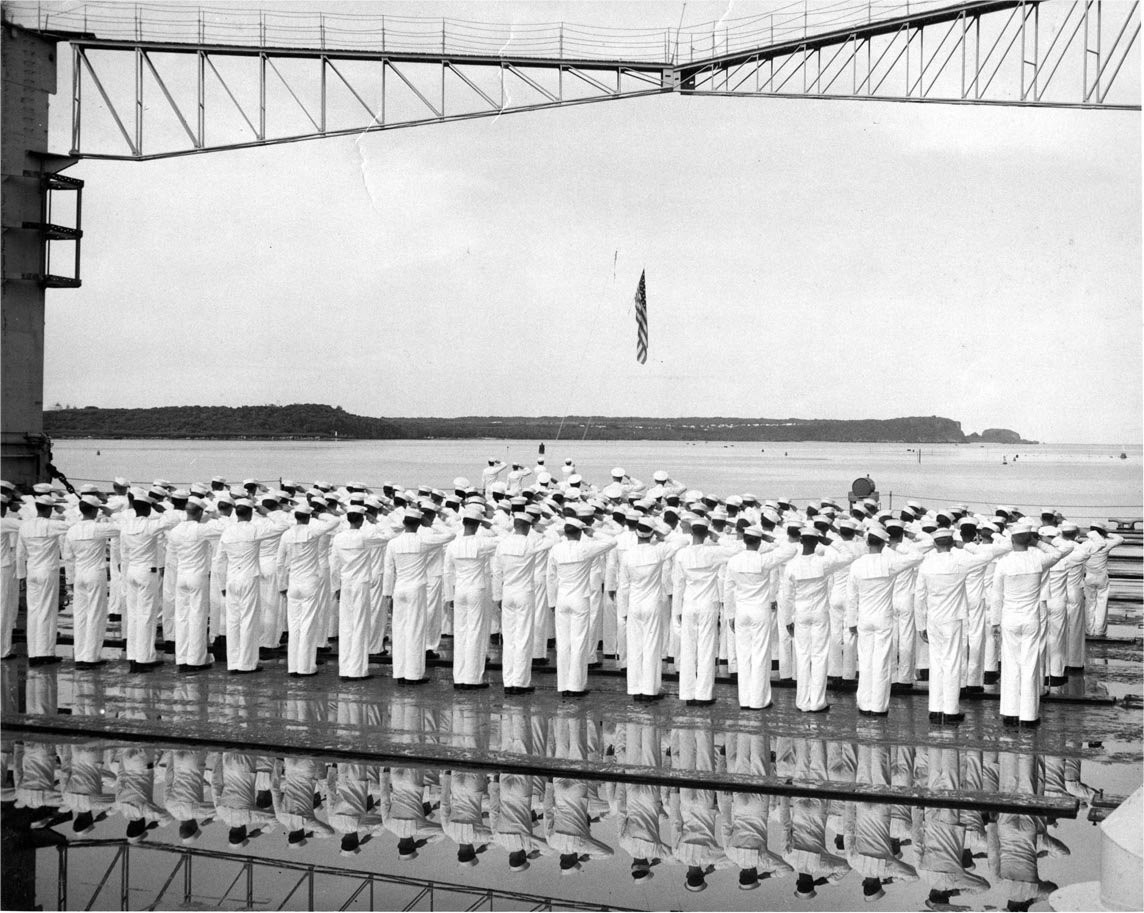 Decommissioning ceremony of USS AFDB-1, Apra Harbor, Guam, Mariana Islands, 1 Nov 1956, photo 2 of 3