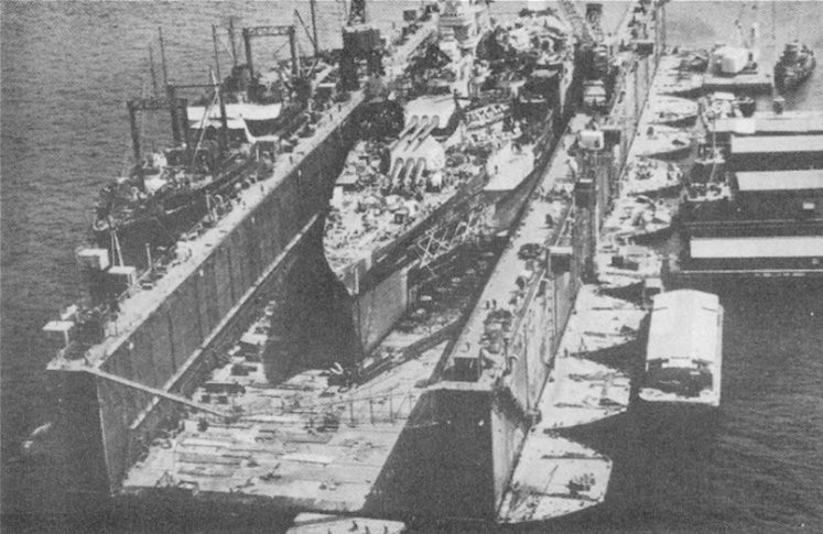 USS ABSD-1 with USS California in the dock, Espiritu Santo, New Hebrides, circa 8 Sep 1944