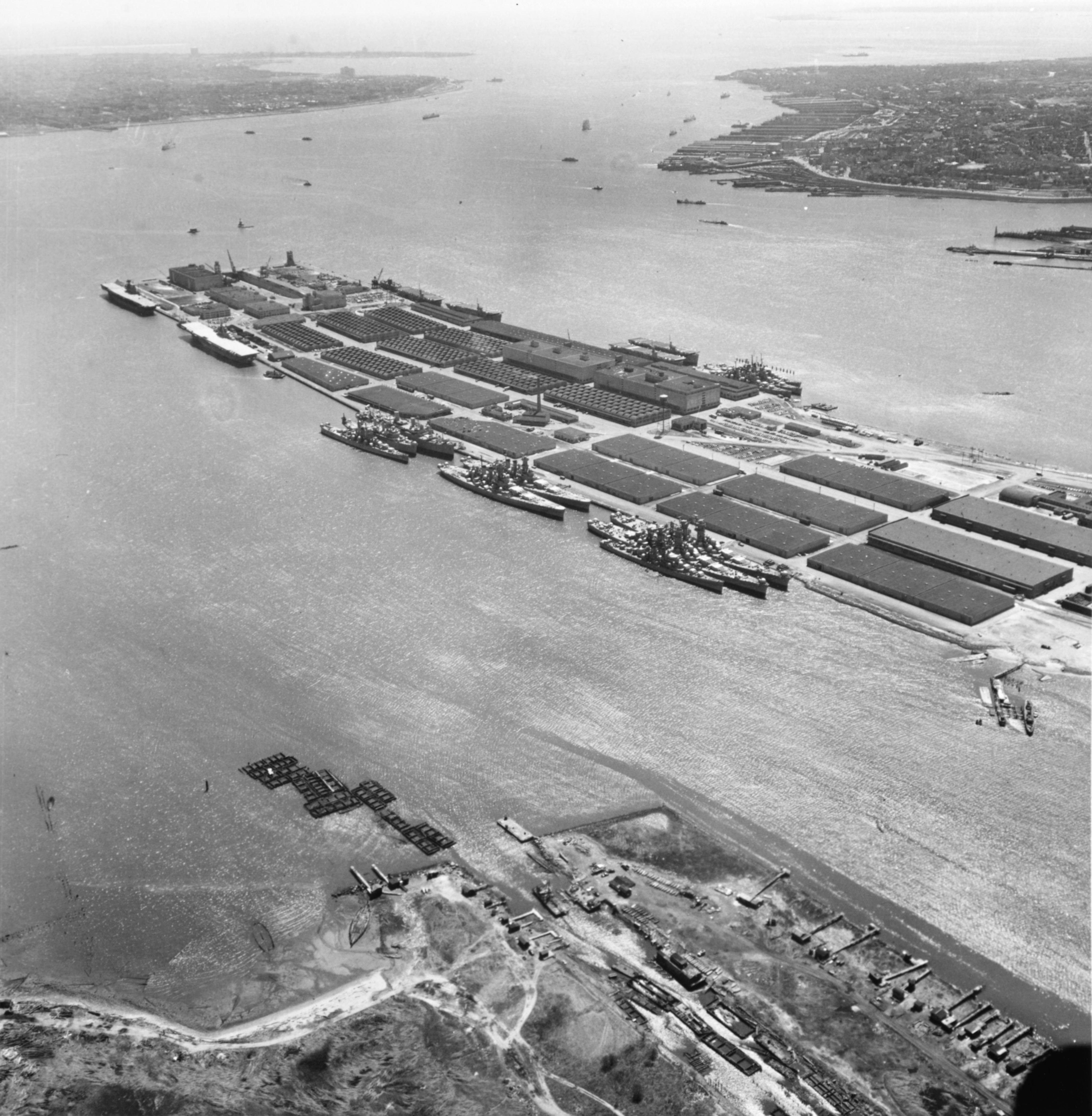 Alaska, Guam, North Carolina, Washington, Enterprise, Franklin, and other ships at  Bayonne Naval Supply Depot, New Jersey, United States, 15 Apr 1953