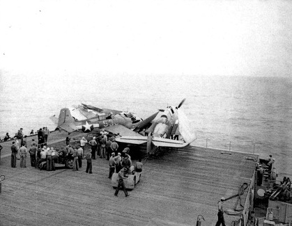 FM-1 aircraft having crashed into several TBF aircraft while landing on the flight deck of USS Coral Sea, 11 Oct 1943, photo 2 of 3