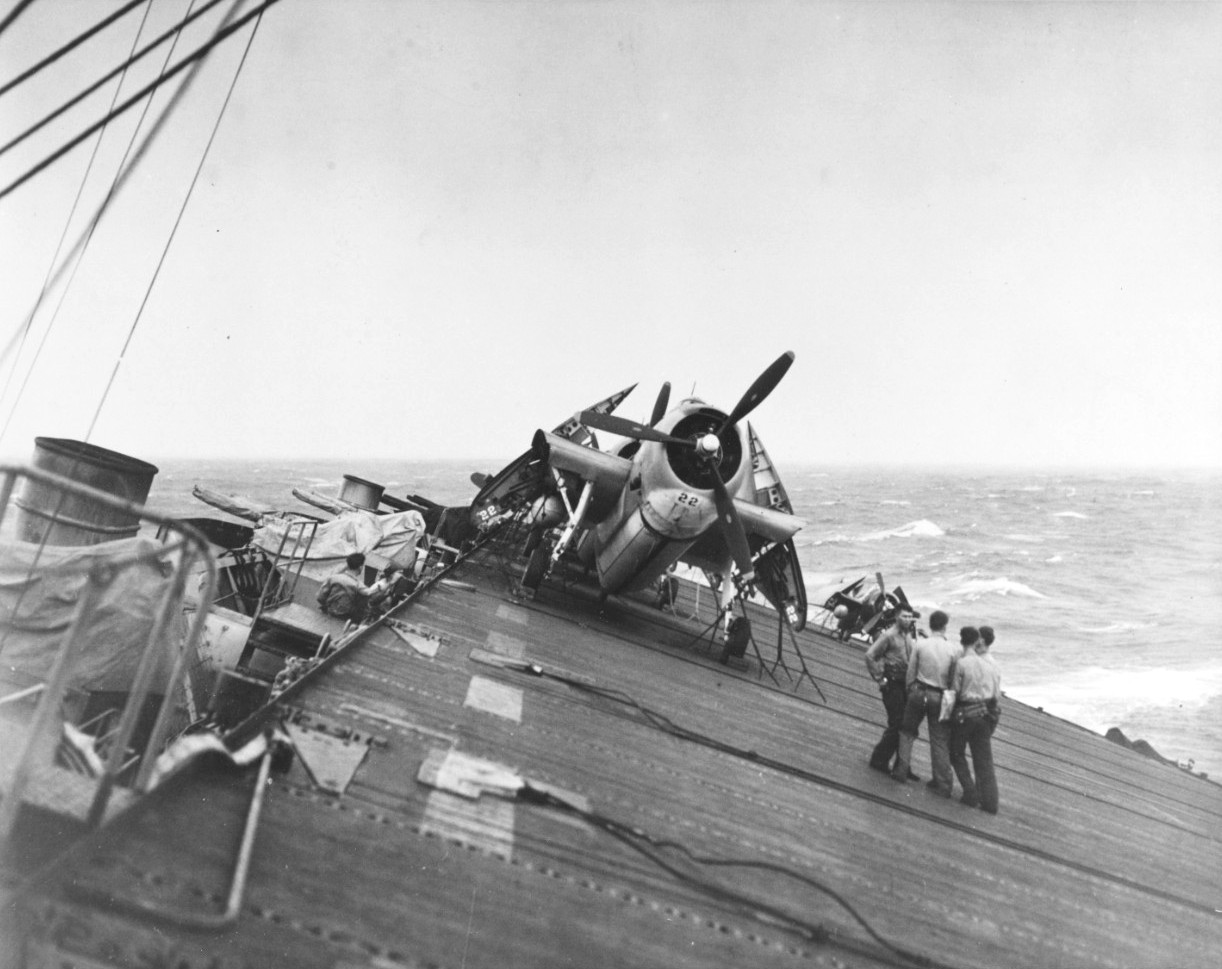USS Anzio rolling in heavy seas, Pacific Ocean, 17 Dec 1944; note Avenger aircraft in foreground and Wildcat aircraft in background; seen in Nov 1945 issue of US Navy publication Naval Aviation News