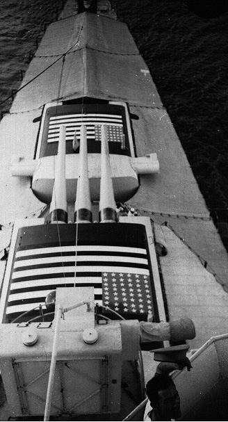 USS Augusta displaying large US flags on top of her turrets during the Second Battle of Shanghai, China, 1937