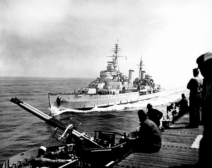 British cruiser HMS Belfast alongside American light carrier USS Bataan off the coast of Korea, 27 May 1952; note Bataan's 40mm twin guns in foreground
