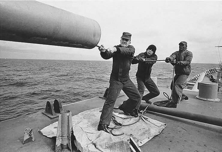 Crewmen of USS Canberra cleaning one of the cruiser's 8-inch guns, Mar 1967