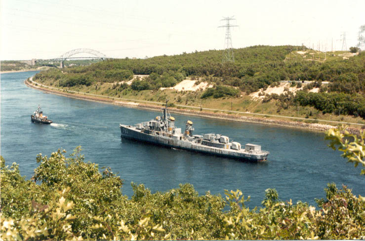 LT-1970 towing USS Cassin Young through the Cape Cod Canal, Massachusetts, United States, Jun 1978; Cassin Young was en route to Charlestown Navy Yard, Massachusetts, United States