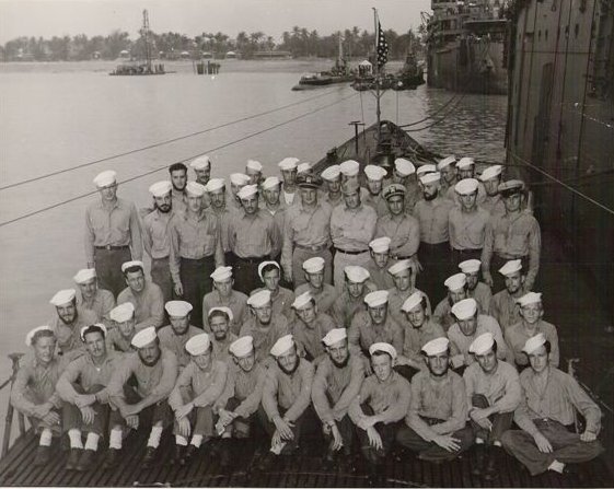 Officers and men of USS Dragonet at Guam, Mariana Islands, mid- to late-Jun 1945; note USS Dragonet was tied to tender USS Proteus