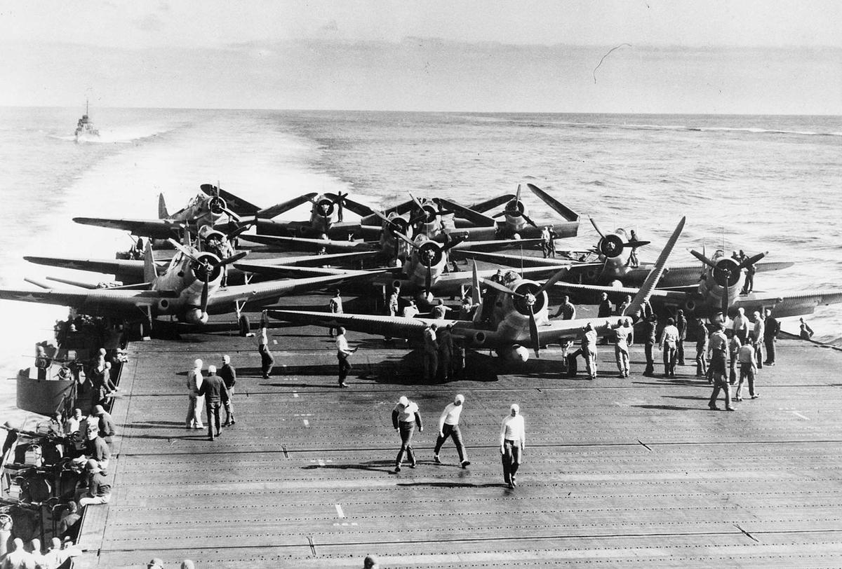 TBD-1 of Torpedo Squadron Six prepared to launch from Enterprise for Midway battle, 0730-0740 on 4 Jun 1942; Pensacola in right background