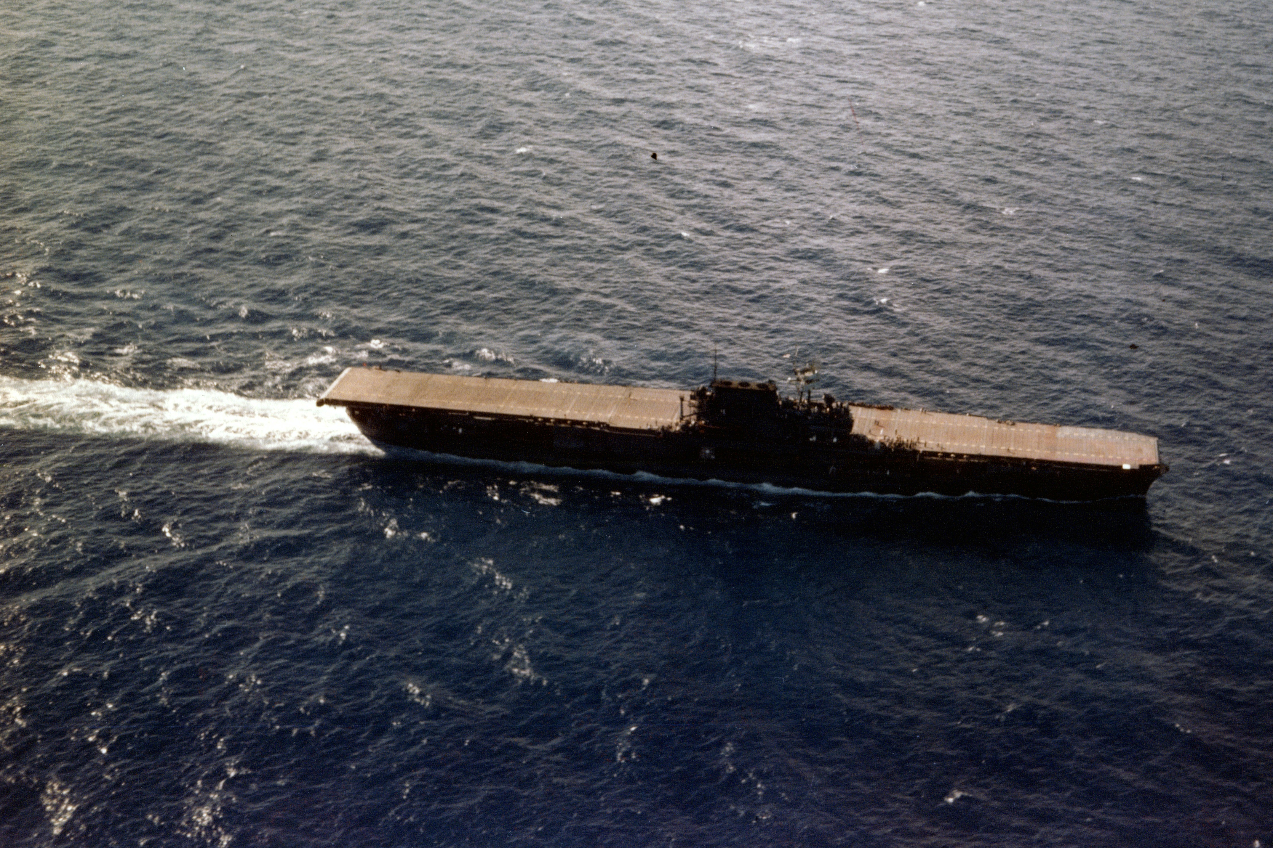 USS Enterprise in the Pacific turning into the wind to recover aircraft, late June 1941 before her natural wood flight deck was stained blue in July 1941.
