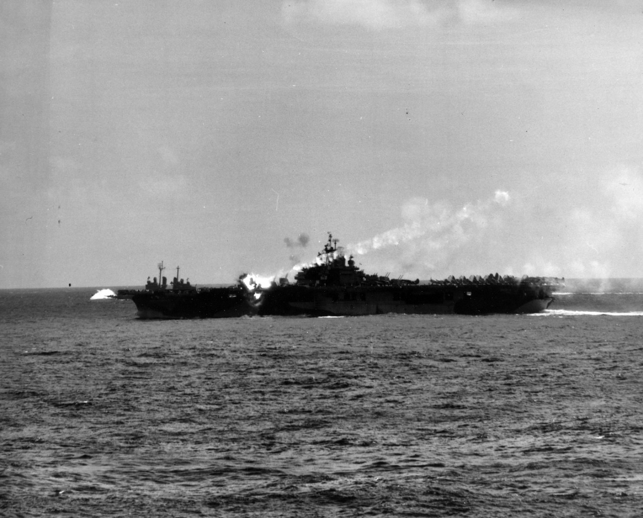 USS Essex struck by Lt. Yoshinori Yamaguchi's special attack D4Y3 Model 33 aircraft, at 1256 hours on 25 Nov 1944, photo 03 of 10