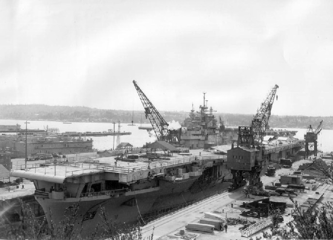 USS Essex undergoing modernization at drydock no. 5 of Puget Sound Naval Shipyard, Bremerton, Washington, United States, 22 Apr 1949; seen in US Navy Naval Aviation News Aug 1949