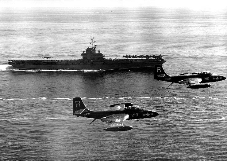 Essex underway during her first Korean War deployment, circa Aug 1951-Mar 1952; note two F2H-2 Banshee fighters in foreground