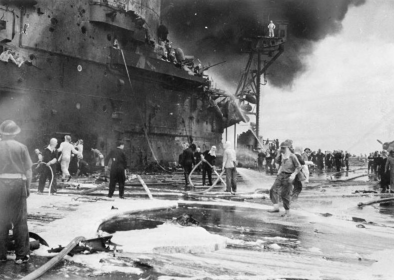Firefighting aboard HMS Formidable after she was struck by a Japanese special attack aircraft in the Pacific Ocean off Sakishima Islands, Japan, 4 May 1945, photo 1 of 2