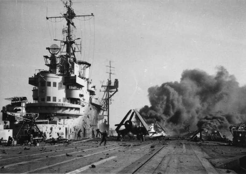 Fires burning aboard HMS Formidable after being stuck by Japanese special attack aircraft, Pacific Ocean, 4 May 1945