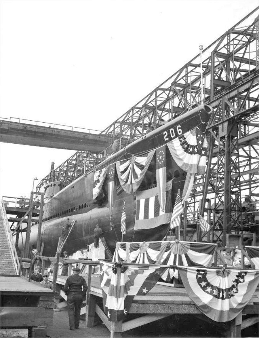 Submarine Gar decorated for launching, showing her bow section, Groton, Connecticut, United States, 7 Nov 1940