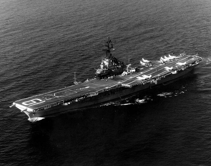USS Hancock off San Diego, California, United States, 11 Feb 1975; note twelve A-4 Skyhawk attack aircraft and one SH-3 helicopter on the flight deck