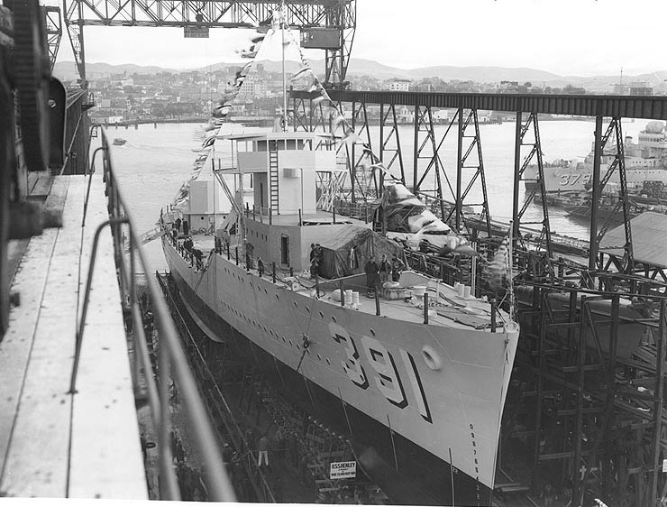 Henley ready for launching, Mare Island Navy Yard, California, United States, 12 Jan 1937; note Preston partially visible through the crane rails, at right
