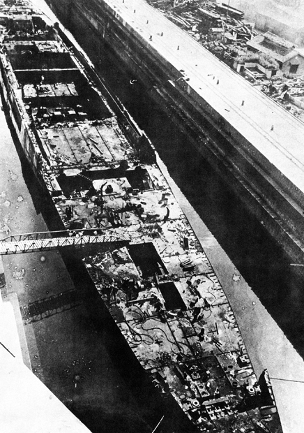 Incomplete light carrier Ibuki being taken apart at Sasebo, Japan, 14 Mar 1947