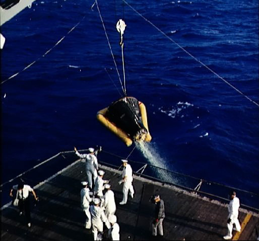 Gemini 3 spacecraft being hoisted aboard USS Intrepid during recovery, in the Atlantic Ocean north of the Dominican Republic, 23 Mar 1965, photo 1 of 2
