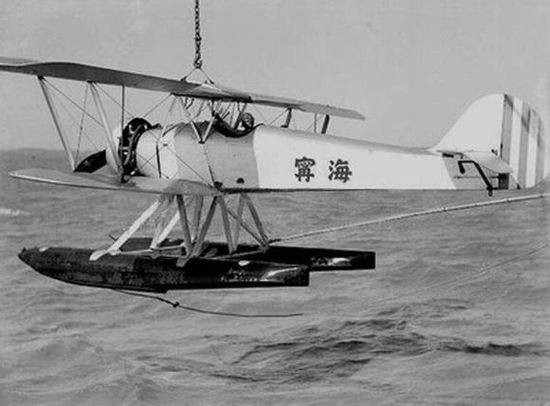 AB-3 seaplane being hoisted aboard light cruiser Ninghai, date unknown