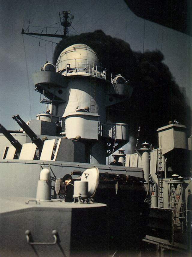 Rear smokestack of USS Iowa at work during shakedown cruise on the east coast of the United States, May 1943; note quad Bofors mount in foreground
