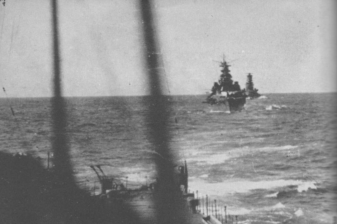 Kirishima and Takao underway, en route to the Guadalcanal area in the Solomon Islands, 14 Nov 1942; photograph taken from cruiser Atago part of which could be seen in foreground